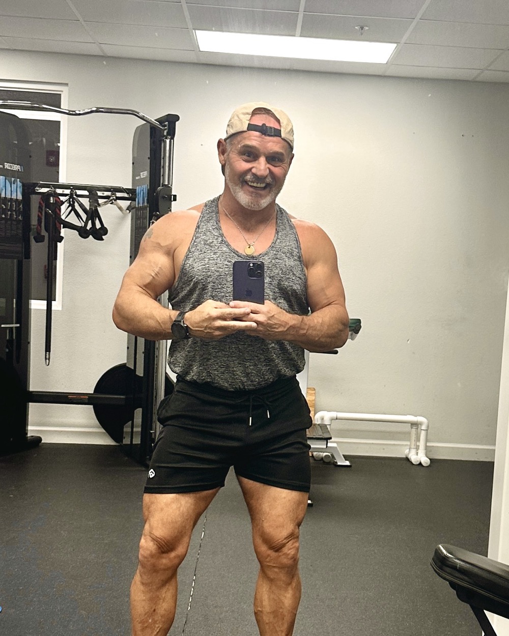 Chris Geagon, founder of SimpleFitnessSite, smiling in the gym