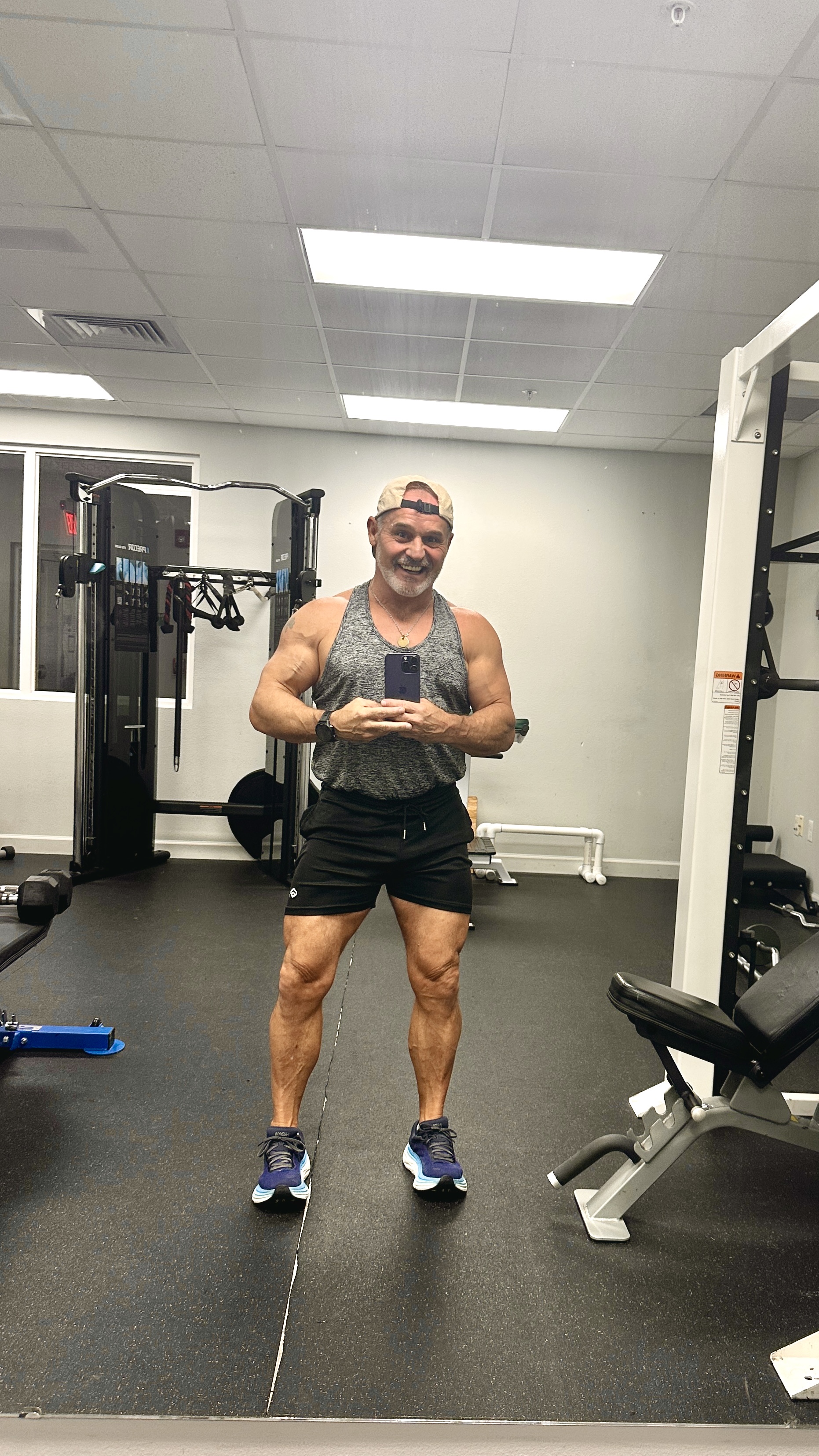 Chris Geagon, founder of SimpleFitnessSite, smiling in the gym